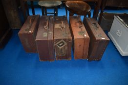 A selection of vintage travel cases including leather