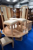 A modern lime oak effect dining room suite comprising octagonal extending dining tables, six chairs,