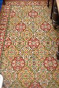 A traditional carpet sqaure in multi coloured tones (af)
