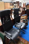 A pair of vintage style swivel office chairs