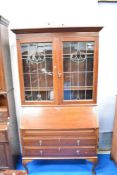 A Victorian style bureau bookcase, having leaded glass top, width approx 105cm.