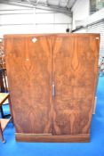 A Art Deco walnut compactum, having fitted interior.