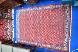 A traditional fireside rug, approx. 150 x 102cm