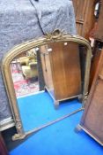 A 19th century gilt plaster over mantle mirror, having sea serpent design, approx 111cm high by