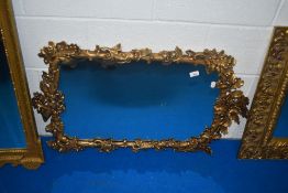 A reproduction mirror, having gilt frame with acorn and oak leaf decoration, approx 91cm high by