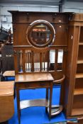 A late 19th or early 20th Century mahogany hall stand having tilt mirror inset and Art Nouveau style