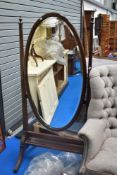 An early 20th Century mahogany oval cheval mirror of large proportions, height approx. 167cm