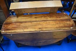 A 19th Century Irish bog oak wake table, having heavy gatelegs, approx. 158 x 162cm opened