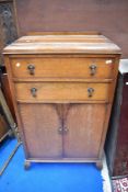 An early 20th century oak tallboy in the Art Deco style, width approx 76cm.