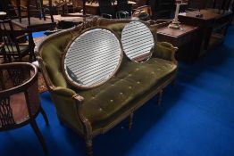 A French style settee having later dralon upholstery