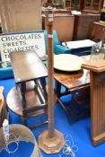 An Arts and Crafts golden oak standard lamp, by Mouseman (Robert Thompson of Kilburn) having
