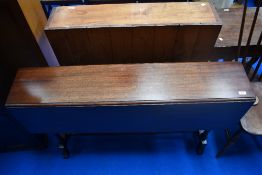 A 19th Century mahogany drop leaf table of narrow proportions on tuned frame, width approx. 122cm
