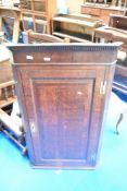 A 19th Century oak corner cupboard , height approx 114cm