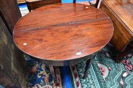 A 19th Century mahogany fold over side table of oval form, approx 97 x 81cm