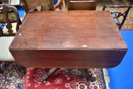 A 19th century mahogany sofa table, having drawers to both ends, on turned column and quatrefoil