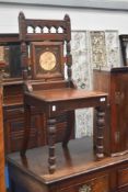 A 19th Century mahogany hall chair having tile to back panel and solid seat