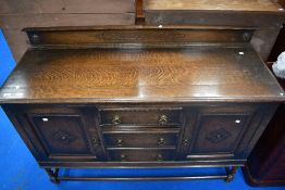An early 20th century oak sideboard on twist frame having ledged back, width approx 144cm.