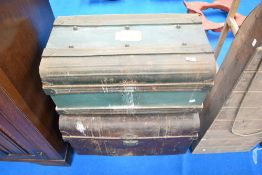 Two vintage tin trunks.