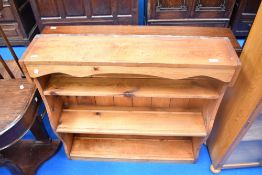 A traditional pine plate rack/bookshelf, approx 93 x 92cm