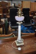 A marble column electric table lamp having been converted from oil , with vaseline glass reservoir