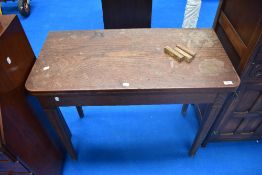 A 19th Century oak fold over tea table, width approx. 92cm
