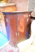 A 19th century mahogany bow fronted corner cupboard, height approx 110cm.