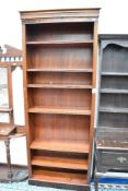 A modern mahogany tall bookcase, approx. height 229cm, width 90cm