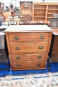 A 19th century oak chest of four long drawers having Arts and Crafts style handles (Splits in two,