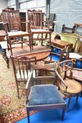 A reproduction Regency style extending dining table and four reproduction carver chairs