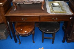 An early 20th Century side table or desk with skiver top and two frieze drawers