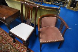 An Edwardian mahogany tub chair and a Georgian style mahogany scroll back dining chair