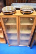 A vintage satinwood bookcase having full length glazed doors, on bun feet, approx dimensions H114