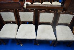 A set of four Victorian upholstered dining chairs