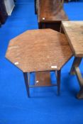 An early 20th century oak hexagonal occasional table, having square under tier.