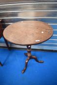 A 19th century oak tripod table having turned column and triple splay legs, diameter approx 68cm.
