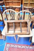 A pair of traditional hoop and stick back kitchen chairs and an oak corner shelf