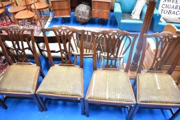 A set of four 19th Century mahogany dining chairs having drop in seats