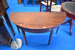 A 19th Century mahogany demi lune table on square tapered legs with extending flap, width approx.
