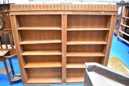 An early 20th Century golden oak double sided library bookshelf, approx dimensions. W206 H190 D41cm
