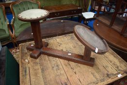 A vintage mahogany shoe fitting stool
