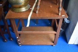 A vintage teak and ply tea trolley