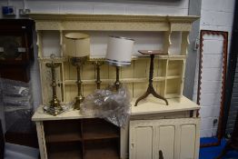 A 19th Century dresser having carved rack and sliding doors to base, later painted, width 218cm