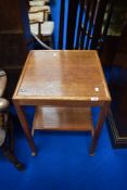 An early 20th Century golden oak tea trolley, square top width approx 50cm