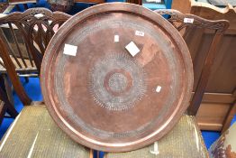A copper tray or table top, diameter approx. 64cm