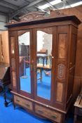 A Victorian mirror door double wardrobe, width 133cm