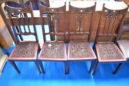 A set of four late Victorian mahognay railback dining chairs with later upholstered seats, Art