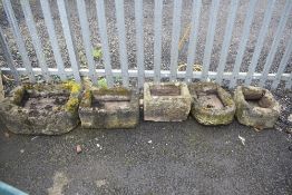 Five small stone troughs