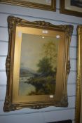 20th Century, coloured print, A lady strolling beside a river, framed, mounted, and under glass,