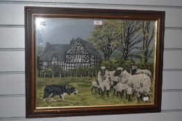 20th Century, a needlework embroidery, Sheep within countryside landscape, framed and under glass