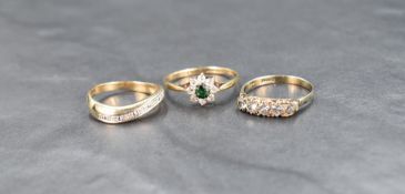 A 9ct gold diamond half eternity ring, the five diamonds in an illusion setting in a wave design,